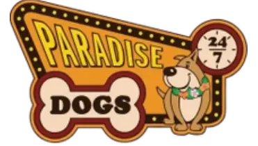 A retro-style sign reads “Paradise Dogs” with a dog wearing a flower lei and a small clock showing “24/7.” The word “DOGS” is inside a bone shape.